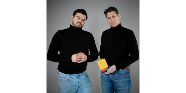 Men posing with coffee pack