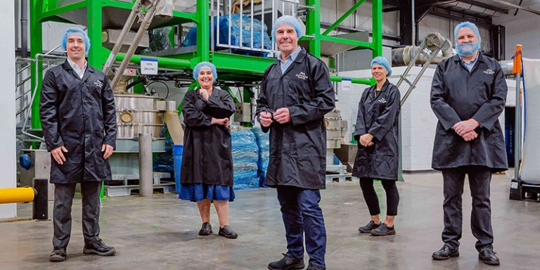 People in factory wearing hairnets