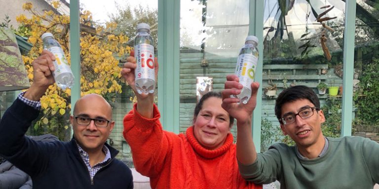 Trio waving bottles of water