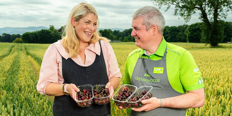 People holding cherries