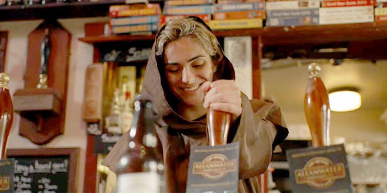 Barmaid pulling pint