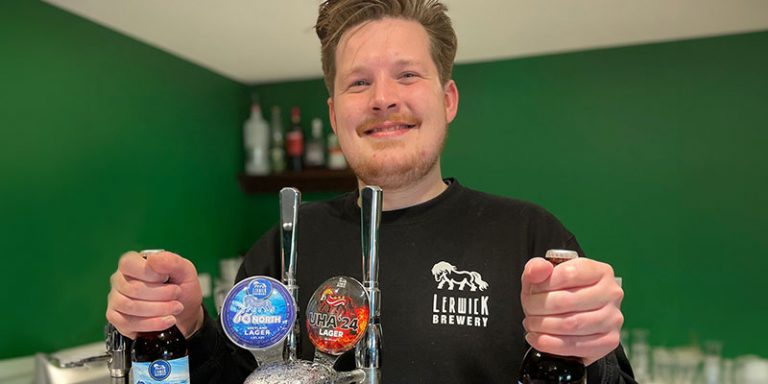 Man holding beer bottles