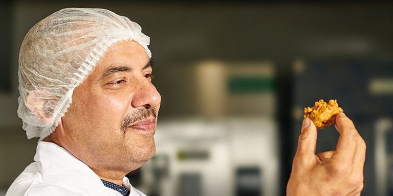 Man holding square sausage pakora