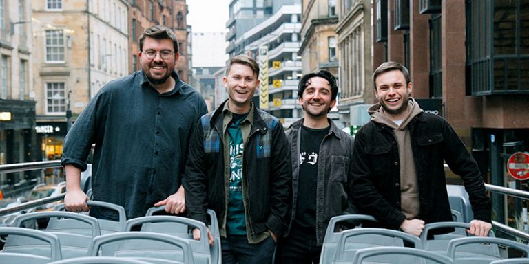 Four men on a bus